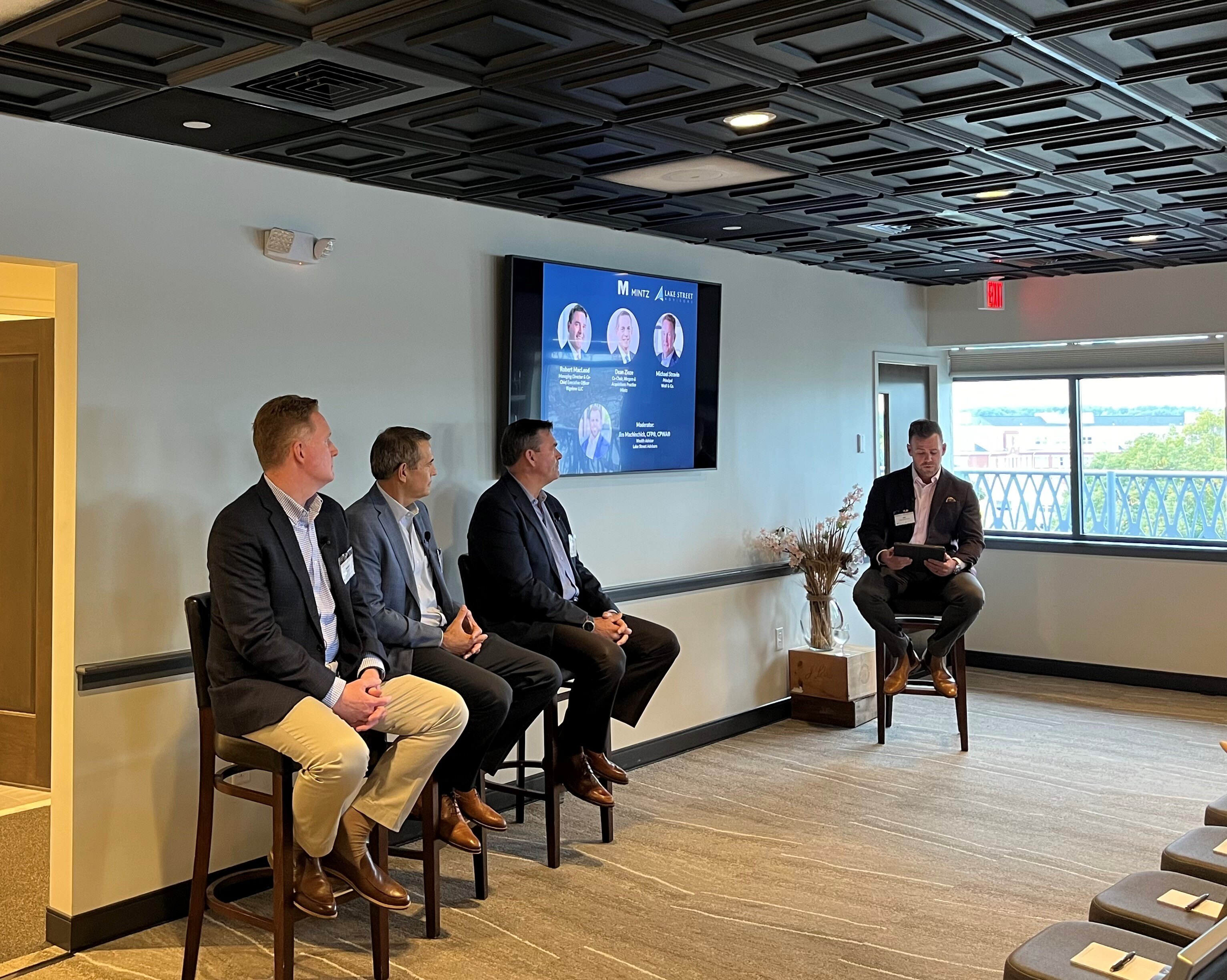 Three panelists and one moderator holding a dicussion